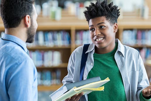 Student shrugging at teacher