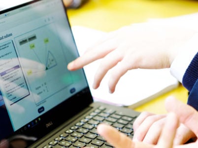 Student using looking at a Degrees and radians 'walkthrough' resource, on Integral, on a laptop